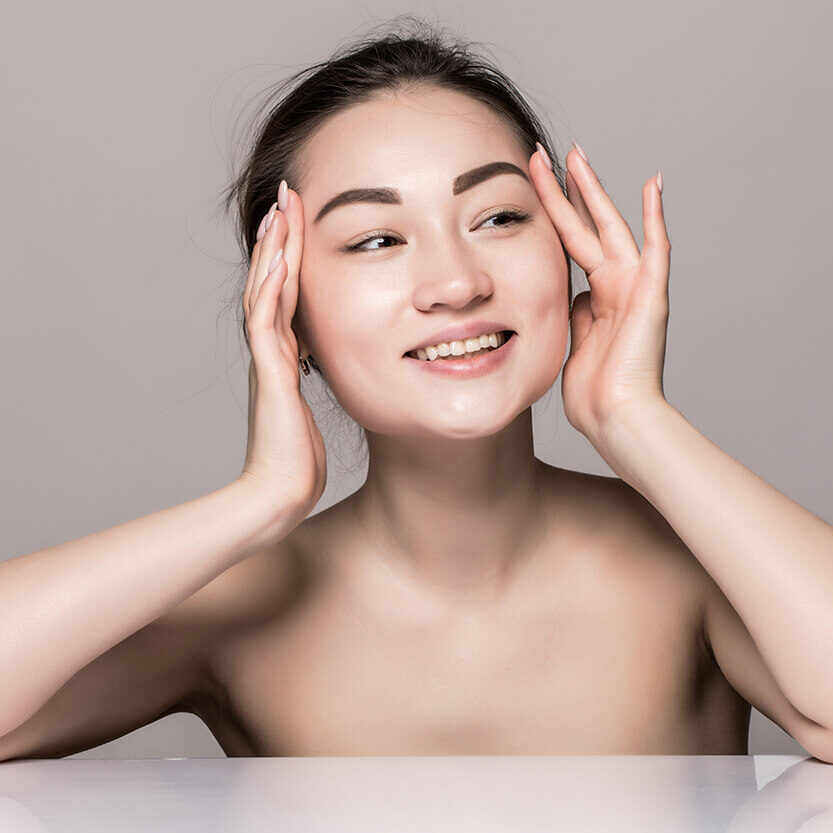 closeup-portrait-young-woman-face-skin-care-with-cosmetics-isolated-gray-wall (1)