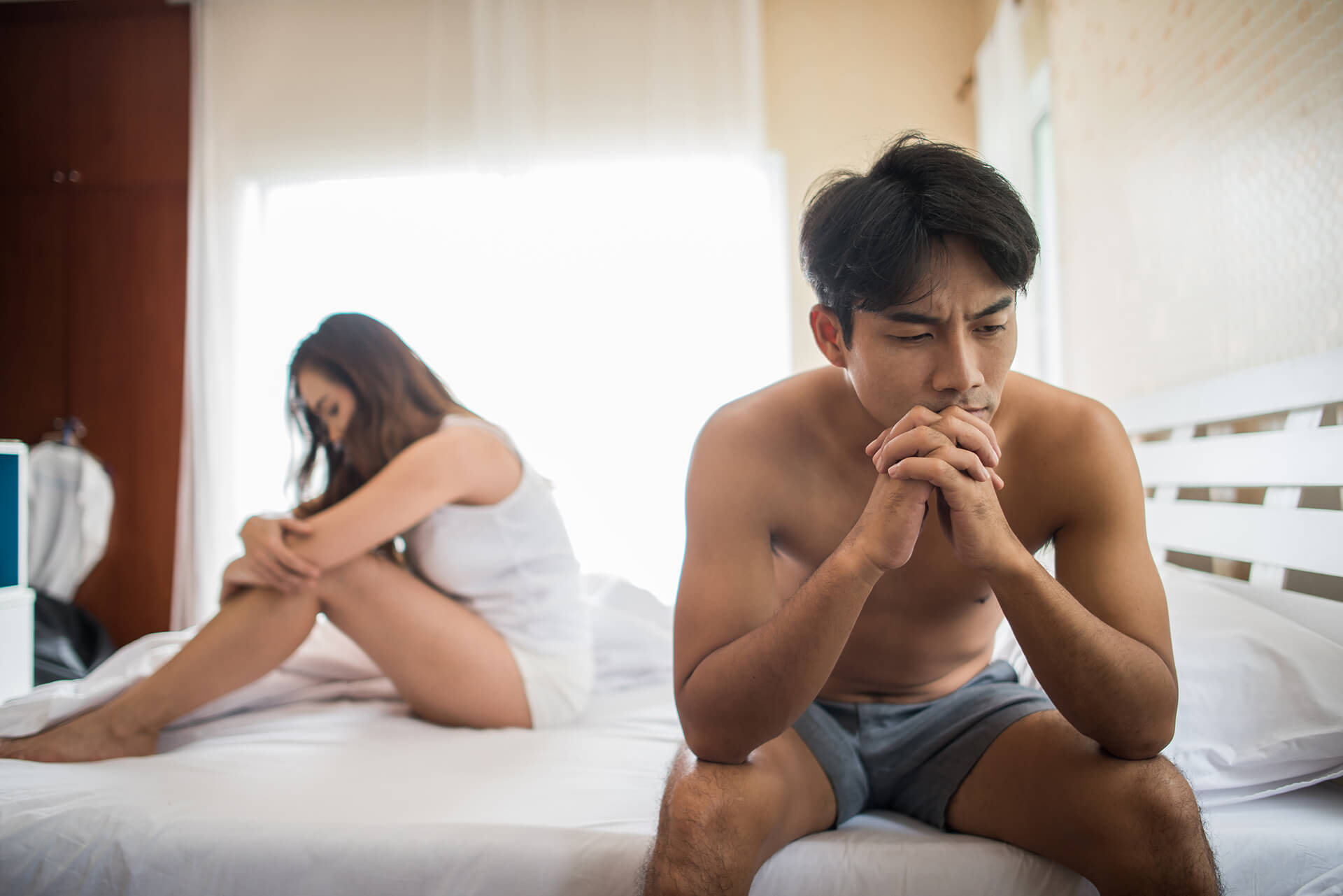 depressed man sitting bed bedroom have problem with his wife 1