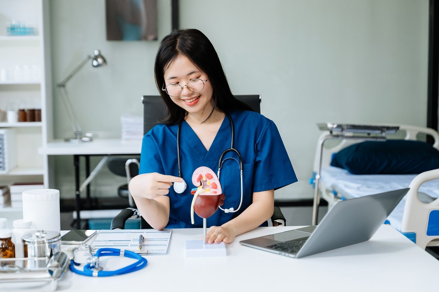 Confident young female doctor in white medical uniform sit at d Treats Damaged Penile